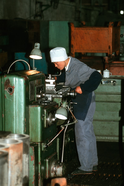 Worker at factory, Beijing, China